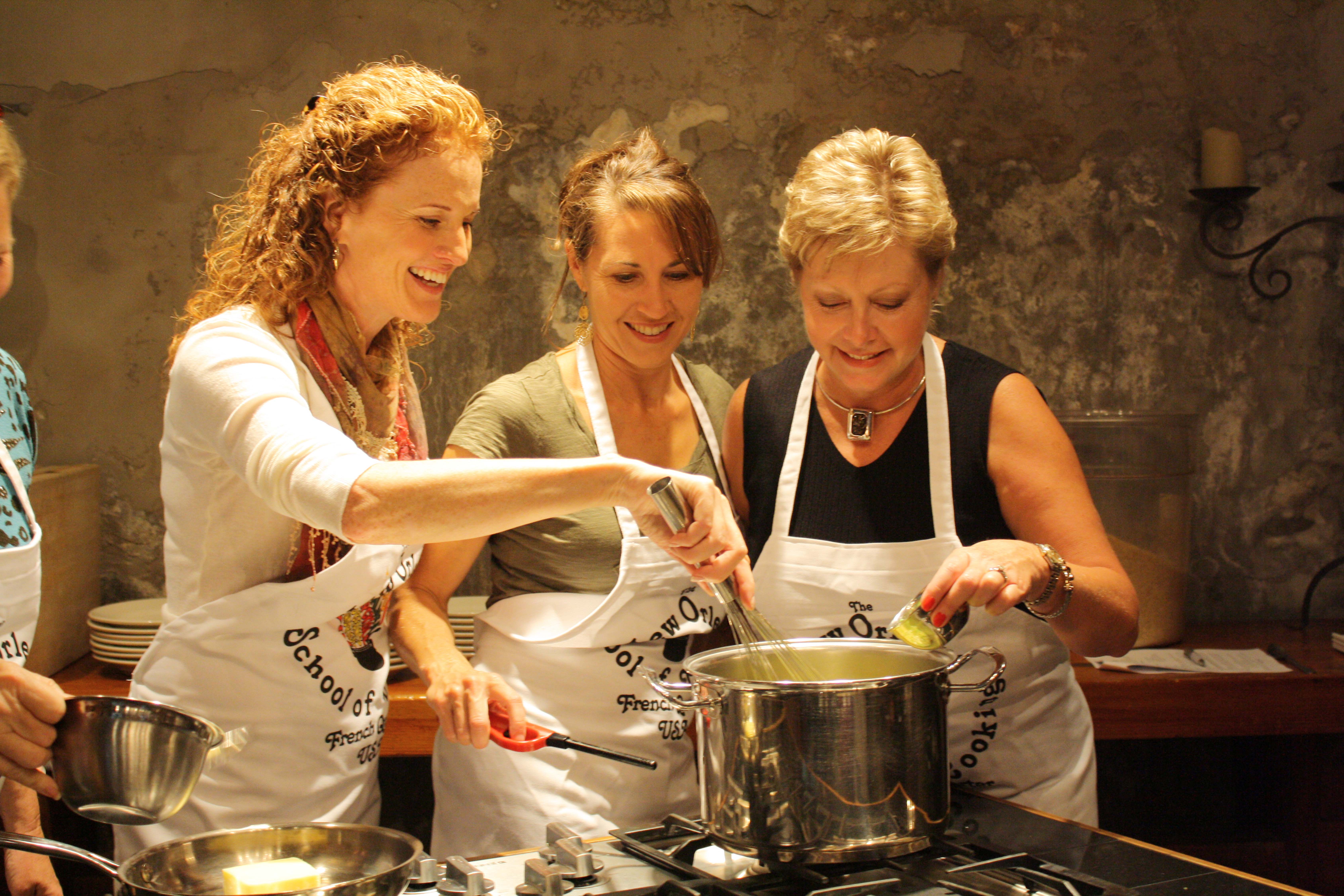 three women cooking holiday tradition