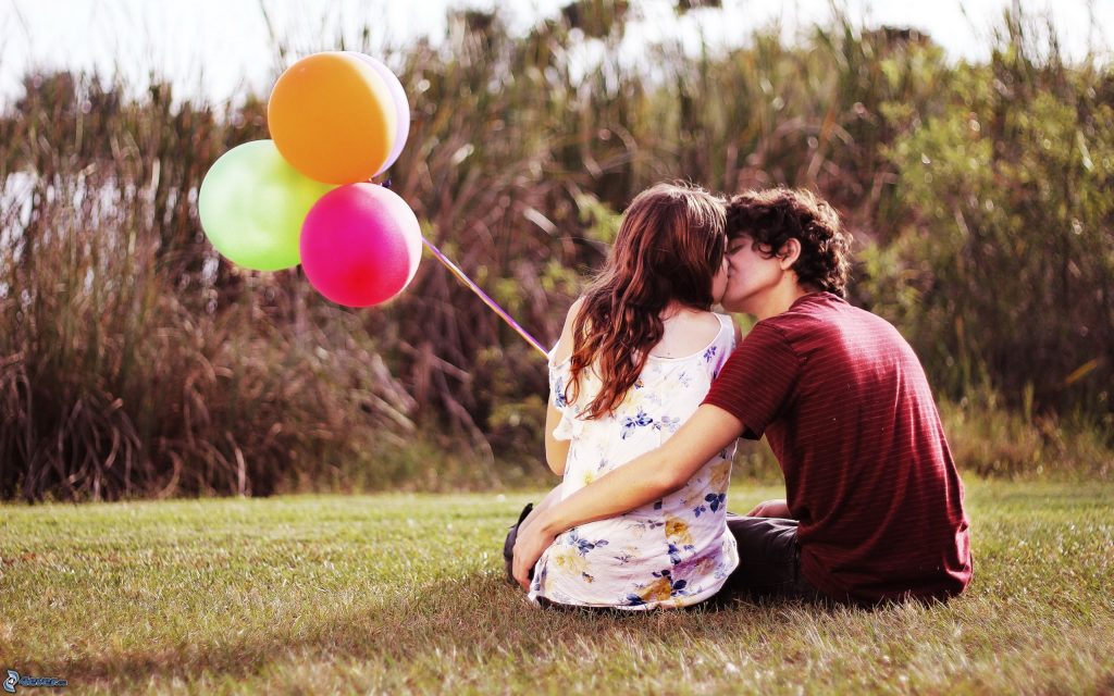 couple on lawn kissing healthy relationship