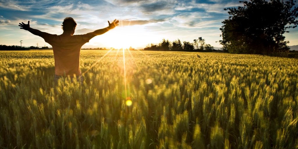 sunshine-depression-help Man in sunshine, feeling happy and free with arms up in sky